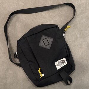 The North Face Black Messenger Bag with Yellow Accents